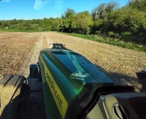 View over a Hampshire field from the cab of a John Deere tractor